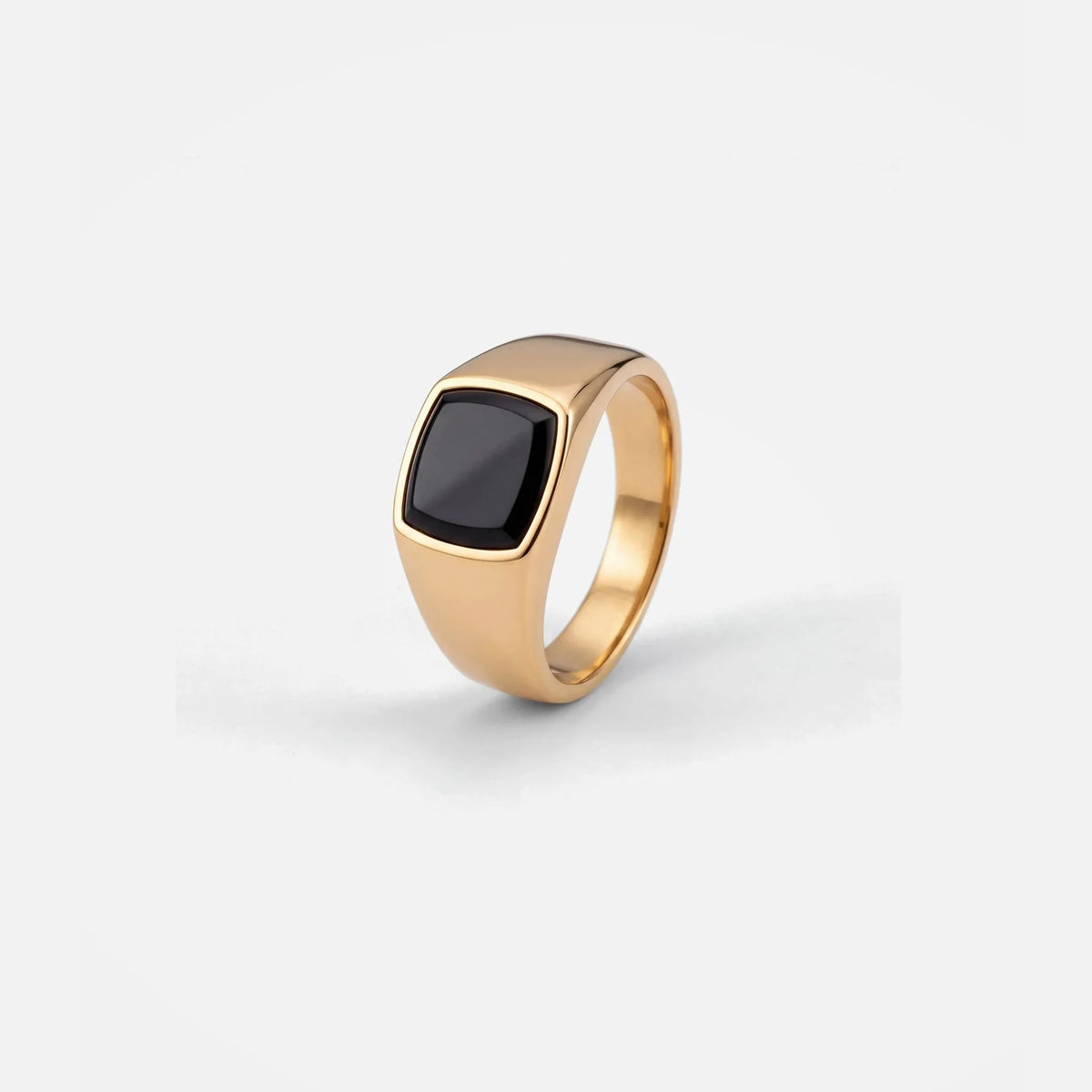 Black Stone Signet Ring in gold PVD stainless steel, studio packshot